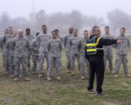 1st Lt. Alicia Lacy Staff Sgt. Anthony Delagarza, a Master Fitness Trainer Course instructor, gives directions to soldiers before a round of guerrilla drills March 3, 2015, at Fort Hood, Texas, as part of the Master Fitness Trainer Course. About 20 National Guard and active duty Army soldiers began the final two weeks of training to become master fitness trainers to act as special advisers to unit commanders to facilitate physical training. (Air National Guard photo by 1st Lt. Alicia M. Lacy/Released)